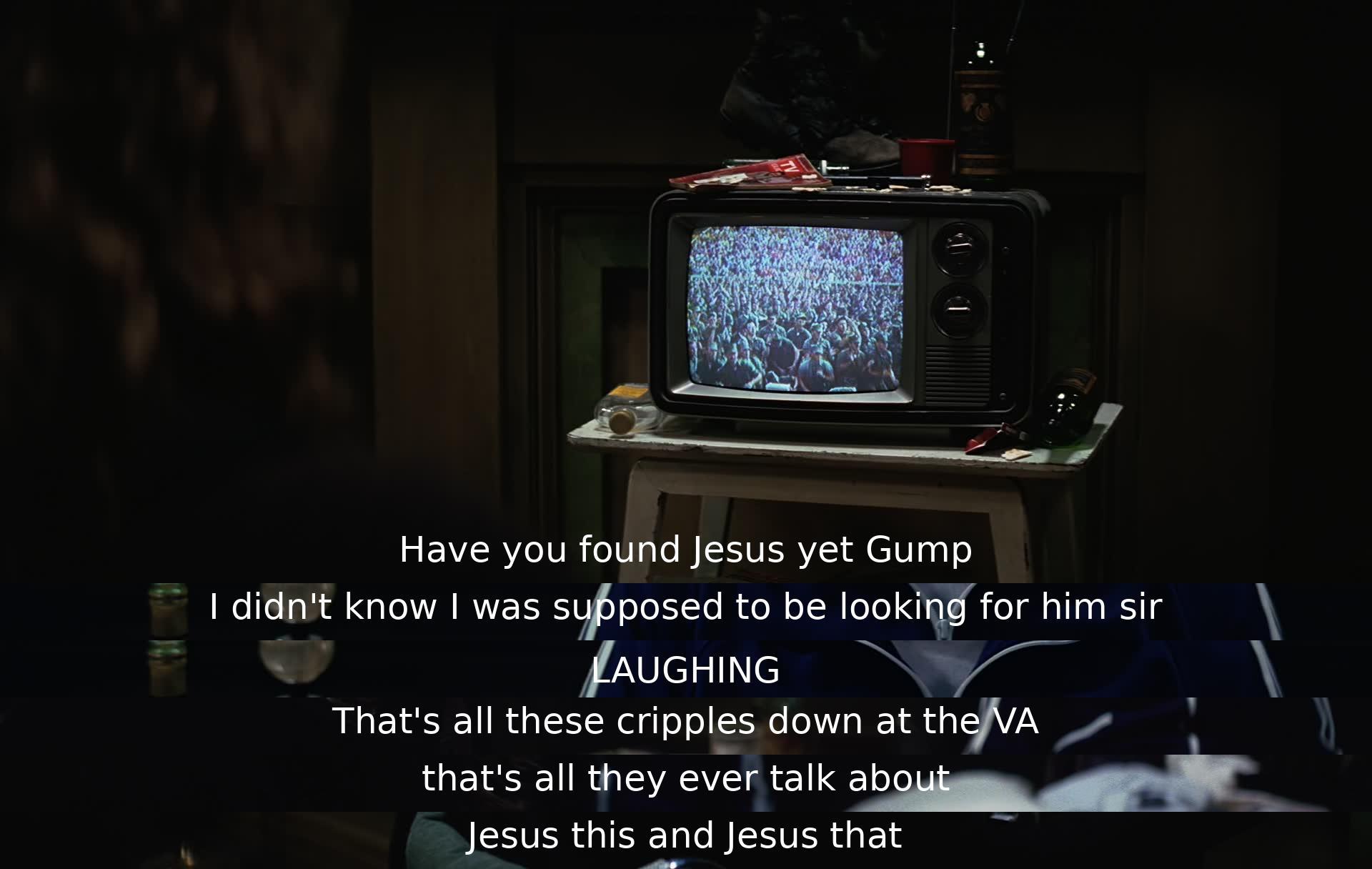 A man asks Gump if he has found Jesus, but Gump replies that he didn't know he was supposed to be looking for him. The man laughs and mentions how others at the VA constantly talk about Jesus, indicating the prevalence of faith discussions among them.