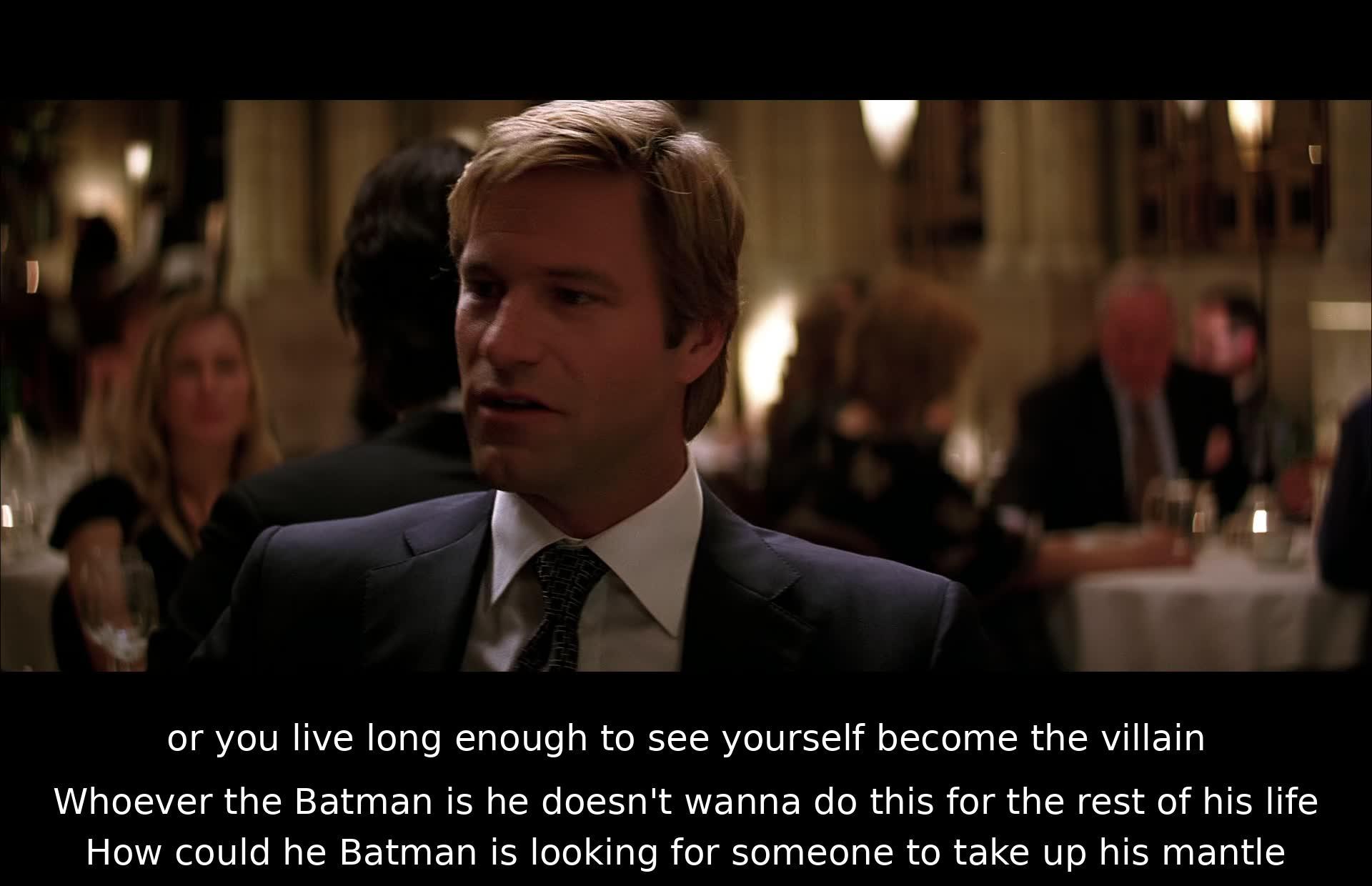 A character reflects that one either dies a hero or lives long enough to become a villain. Batman is searching for someone to succeed him and fears being stuck in the role forever.