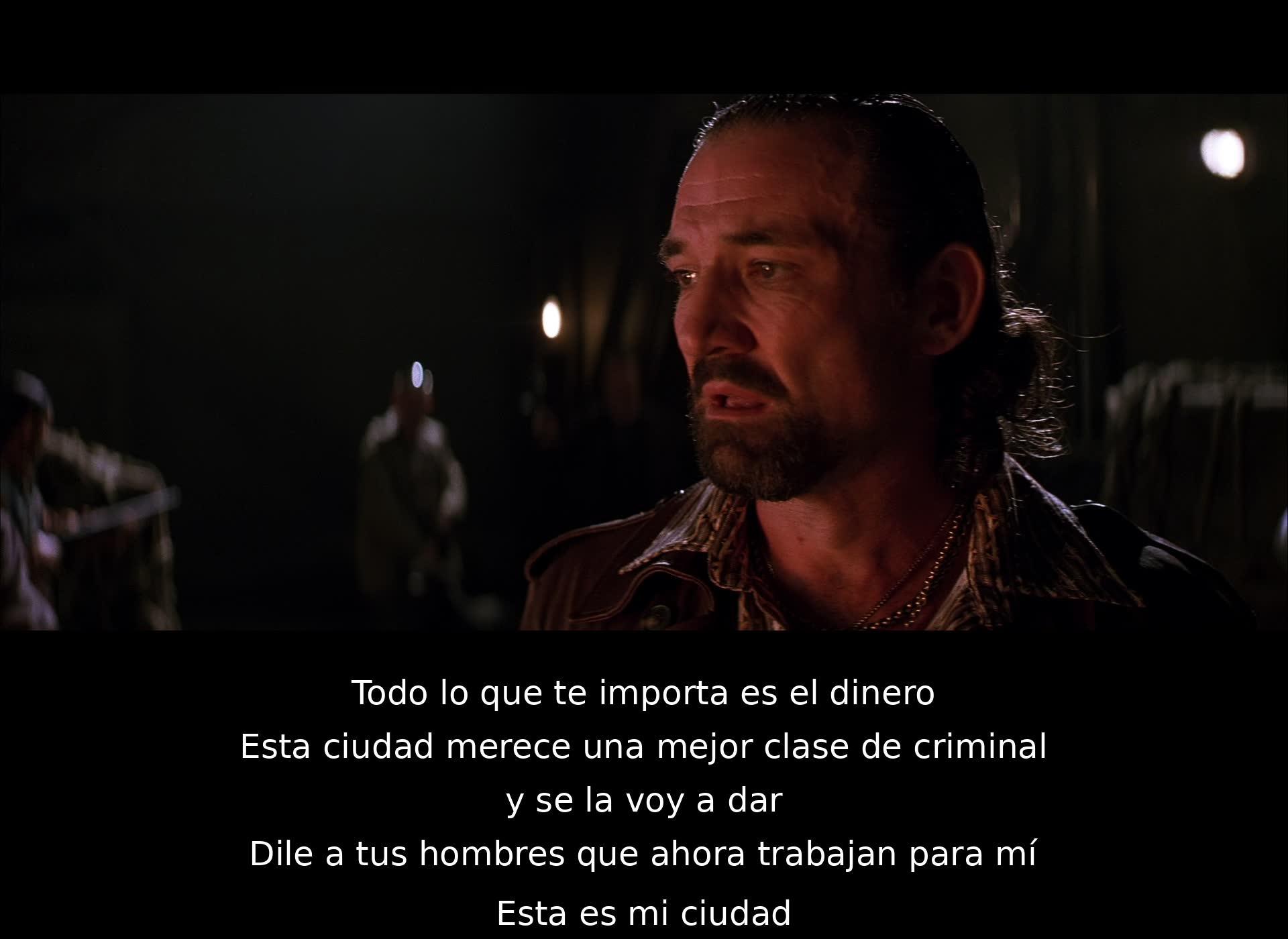 Un personaje declara que la ciudad merece un criminal mejor y planea tomar el control. Exige lealtad y advierte que ahora sus hombres trabajan para él. Reclama la ciudad como suya.